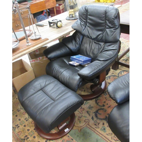 449 - Black leather stressless armchair with footstool