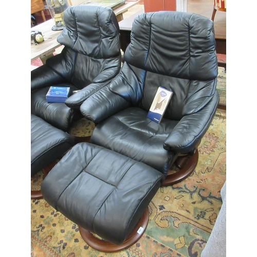 450 - Black leather stressless armchair with footstool