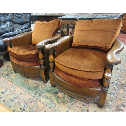 451 - Pair of leather and carved oak tub chairs