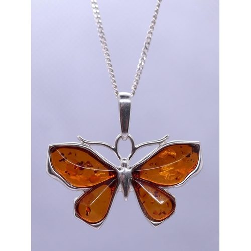 53 - Silver & amber butterfly pendent on chain