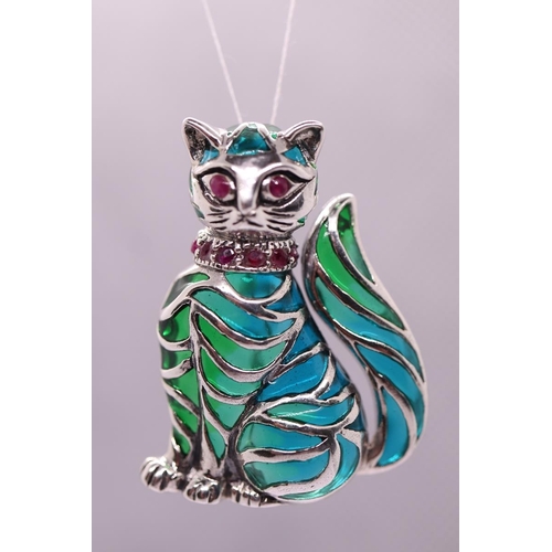 56 - Silver & enamel ruby eyed cat brooch/pendent