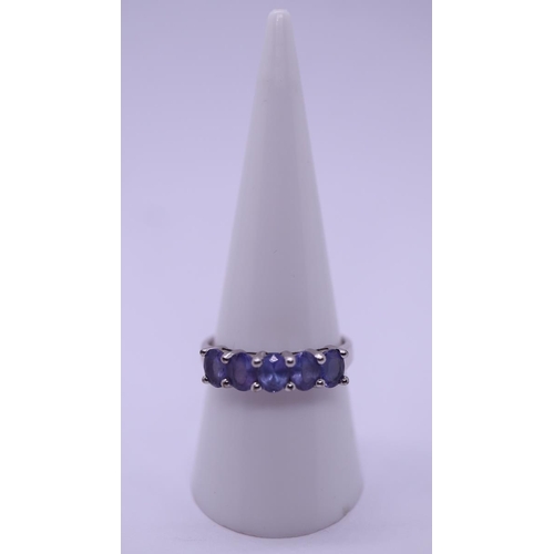 82 - 9ct white gold 5 stone tanzanite set ring - Size Q