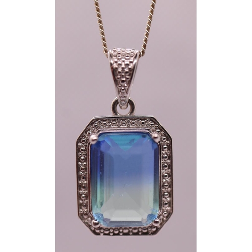 102 - Silver blue topaz set pendent on chain