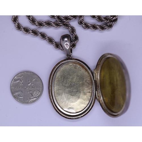 103 - Oval silver locket on silver rope chain