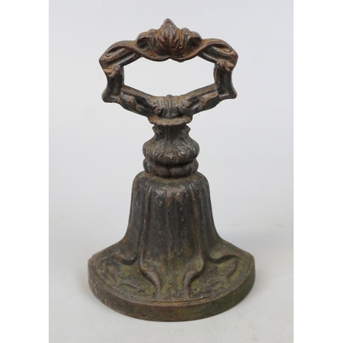 194 - Brass trivet together with a cast iron door stop