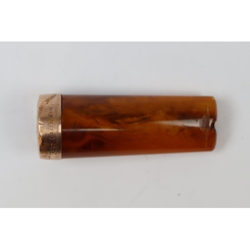 4 - Amber and 9ct gold mounted cheroot holder in sterling silver container