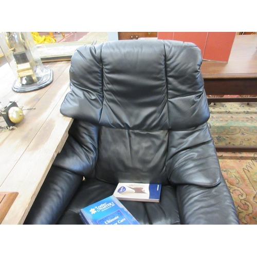 449 - Black leather stressless armchair with footstool