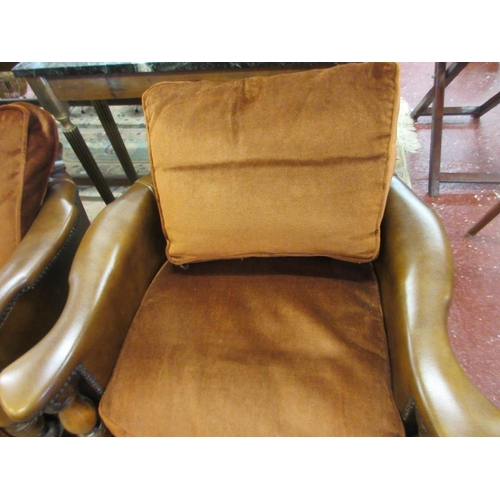 451 - Pair of leather and carved oak tub chairs