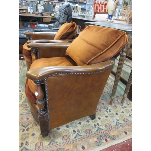 451 - Pair of leather and carved oak tub chairs