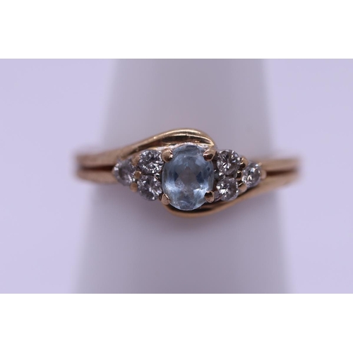 52 - 9ct gold aquamarine & diamond set ring - Size M