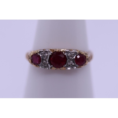 62 - 9ct gold ruby & diamond set ring - Size K