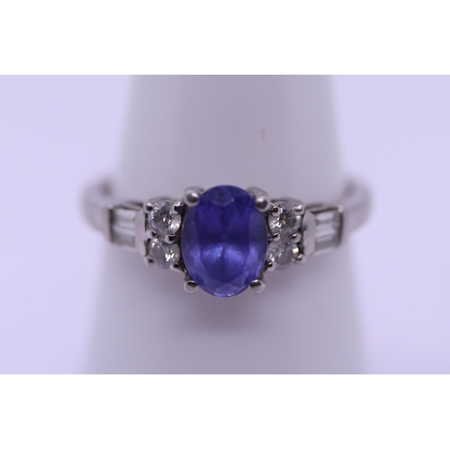 81 - Tanzanite and diamond platinum ring - Size R