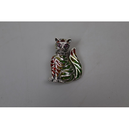 18 - Silver enamelled ruby eyed cat brooch/pendant