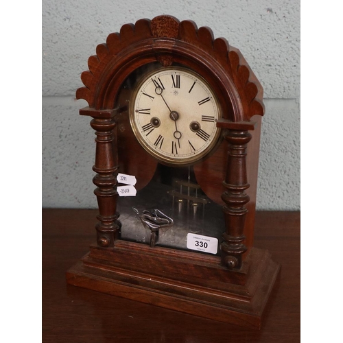 330 - Early 1900s mantle clock with its key in good order