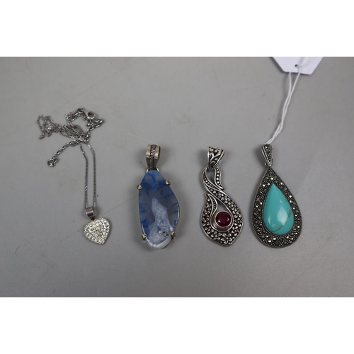 68 - 4 silver mounted pendants