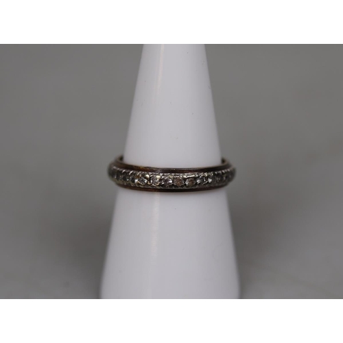 78 - 9ct gold stone set eternity ring - Size O