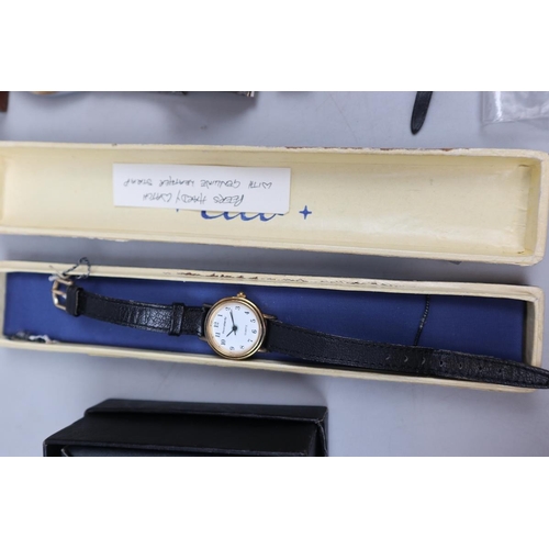 115 - Box of watches to include a vintage silver watch & new boxed watches