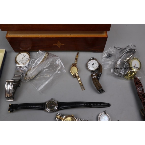 115 - Box of watches to include a vintage silver watch & new boxed watches