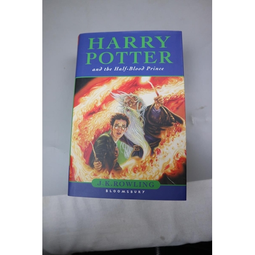 131 - 3 Harry Potter books to include 2 1st editions including The Half Blood Prince with type error