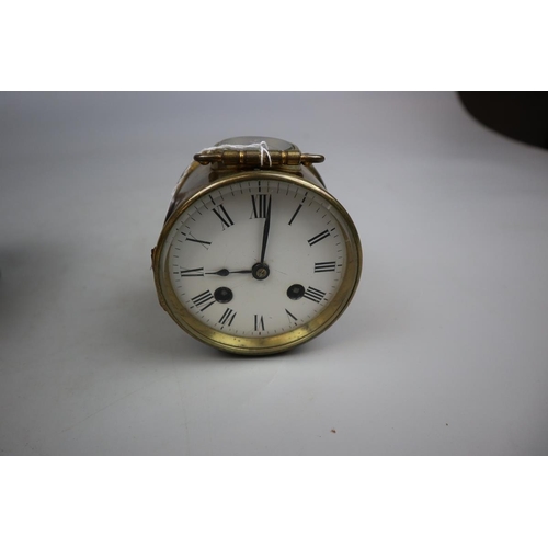 194 - Drum shaped carriage clock with original case and key