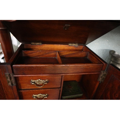 216 - Edwardian oak smokers cabinet, with collection of match books, and tobacco tins