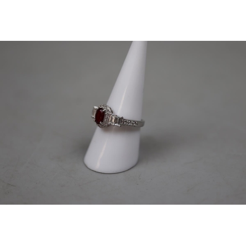 27 - Silver garnet set ring - Size P