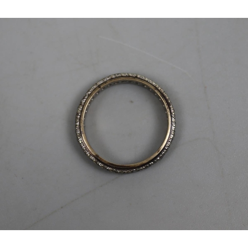 78 - 9ct gold stone set eternity ring - Size O