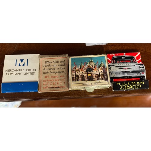 216 - Edwardian oak smokers cabinet, with collection of match books, and tobacco tins