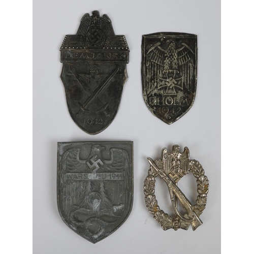 18 - 3 German breast shields - Warschau (Warsaw), Demjansk and Cholm together with German infintary badge