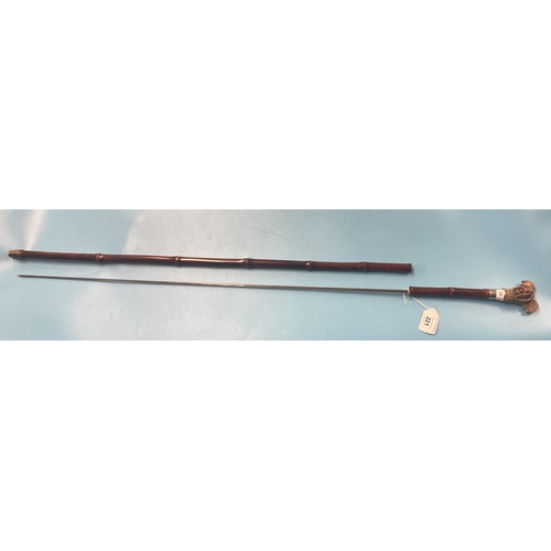 221 - Bamboo cane swordstick with carved wooden handle of a Yorkshire Terrier