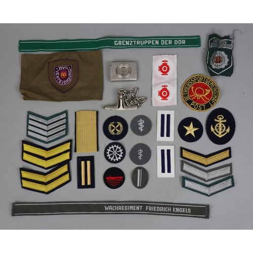 43 - East German badges and Stasi restraints