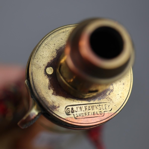 137 - A vintage copper and brass colt pistol powder flask featuring an embossed eagle together with an ant... 