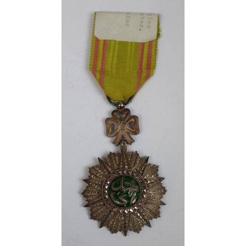 21 - French colonies and protectorates Order of Nichan-Iftikher-Tunis together with another medal