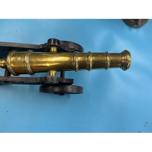 304 - Cast iron canon with brass barrel - Approx length 47cm