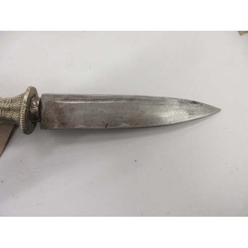 352 - Tibetan 'Khampa' knife with ornately decorated white metal handle and scabbard