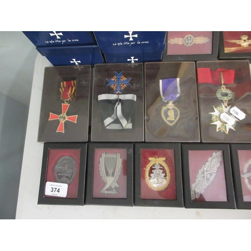 374 - Large collection of reproduction militart medals and badges etc