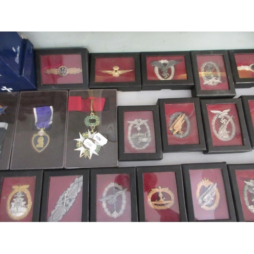 374 - Large collection of reproduction militart medals and badges etc