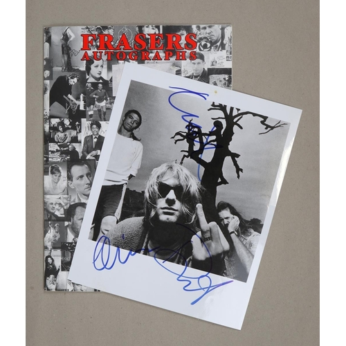 141 - 10x8 B&W promotional photograph of Nirvana.  Signed in blue ink by all three band members (typic... 