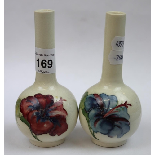 169 - Pair of small Moorcroft bottle vases queen Mary paper labels to the base - Approx height 12cm