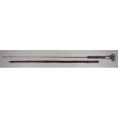 180 - Bamboo cane swordstick with carved wooden handle of a Yorkshire Terrier - Approx length 90cm