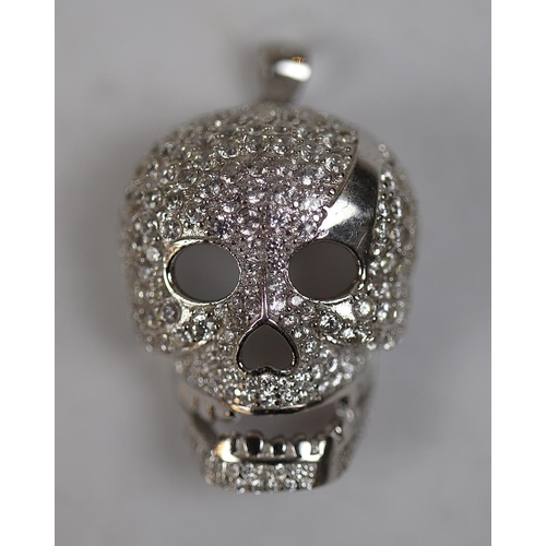 28 - Stone set silver pendent in the form of a skull