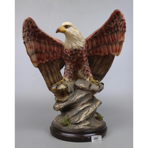 380 - Large Eagle figure on wooden plinth - Approx height 47cm