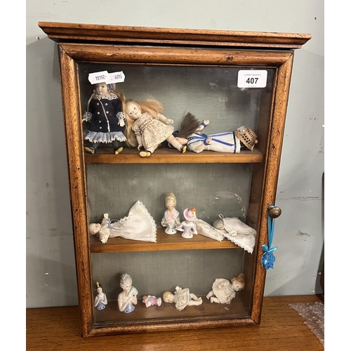 407 - Table top display cabinet with dolls and half dolls