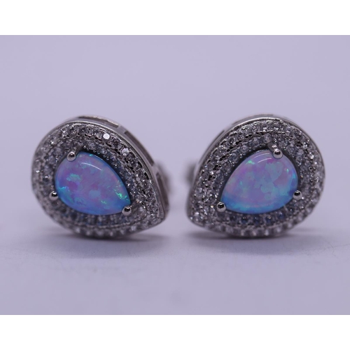 54 - Pair of opal & stone set silver earrings