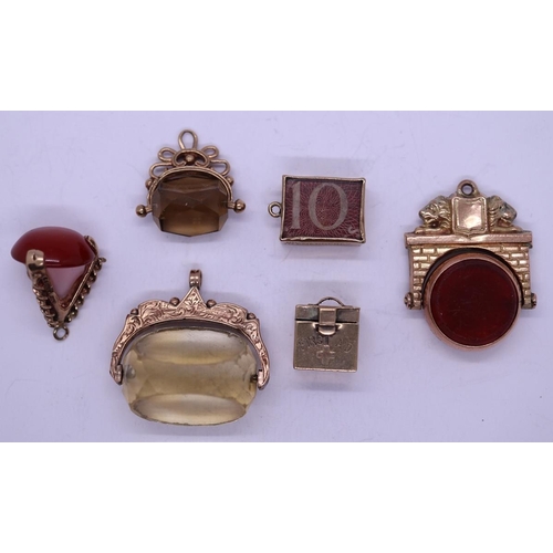 78 - Collection of 9ct gold charms and pendants