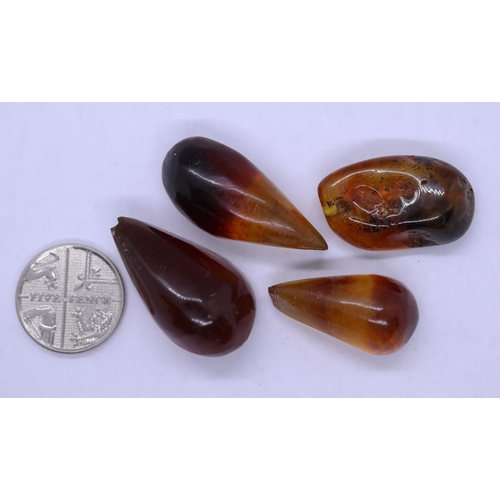 96 - 4 pieces of 10ct polished mixed amber