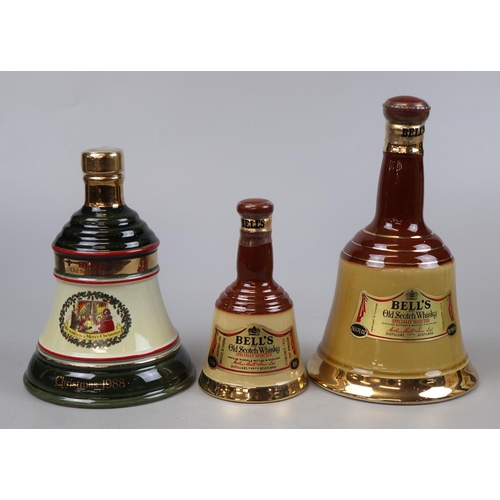 140 - 3 Bells whisky decanters with contents