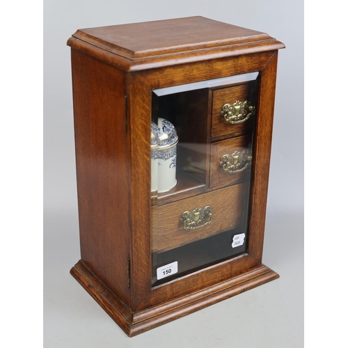 150 - Edwardian oak bevel glazed smokers cabinet with gilded, blue and white porcelain humidor and white m... 