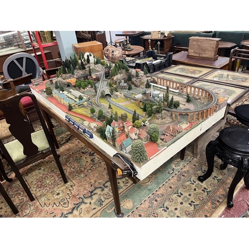 302 - Marklin Z-gauge model train set diorama on table. Wired with track but no rolling stock. Complete wi... 