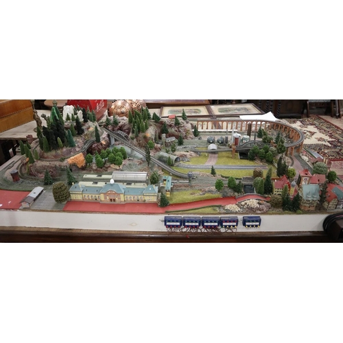 302 - Marklin Z-gauge model train set diorama on table. Wired with track but no rolling stock. Complete wi... 